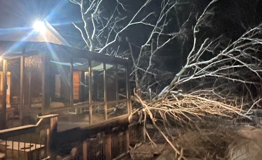 Storm debris on a floor deck damaging the house after a storm that happened at night in St. Louis.